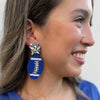 Royal Blue Beaded Football Earrings with a crystal star cluster top on them.